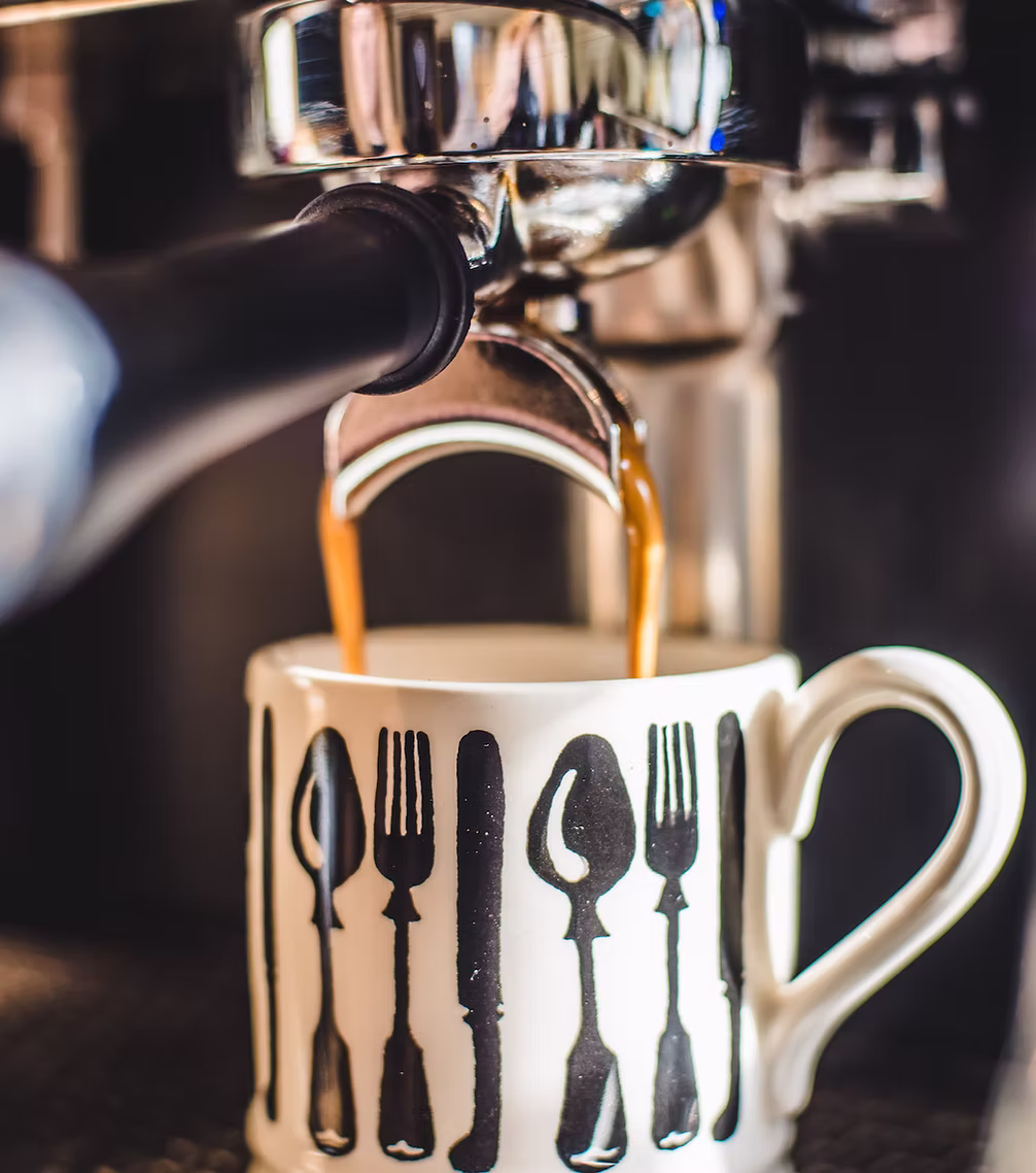 A flat white being poured by our barista
